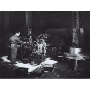 The Ilva Factory of Genoa, a Worker Near a Bolt Shearing Machine 