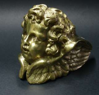 bronze cherub angel head with wings furniture part ?  
