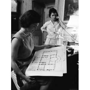  First Lady Jacqueline Kennedy Looking over Blueprints 