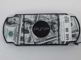 Black Sony PSP 2000 with a hundred dollar bill skin applied (for parts 