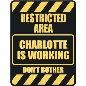   RESTRICTED AREA CHARLOTTE IS WORKING  PARKING SIGN