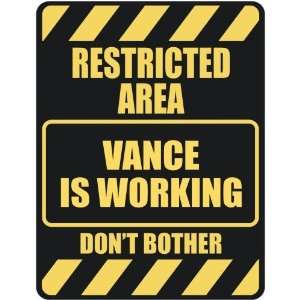   RESTRICTED AREA VANCE IS WORKING  PARKING SIGN