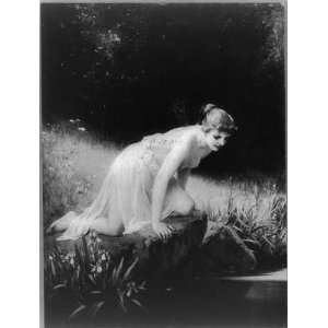   kneeling at edge of water,c1907,Mythology,rock,grassy