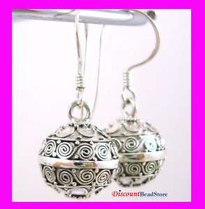   Silver jingle bell chime round sphear harmony Ball earrings HE10