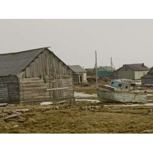  An Old Boat Sits Amongst Sheds and Houses in Snopa Village 
